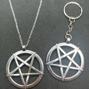 May include: Two silver pentagram pendants, one on a chain and the other on a key ring. Both pendants feature a five-pointed star within a circle.