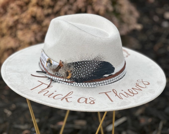Lainey Wilson - Thick as Thieves - Custom hand burned wide brimmed cowgirl hat with wording and flowers burned on the brim, ticket stub
