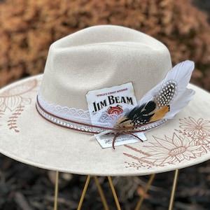 Custom hand burned wide brimmed cowgirl hat
