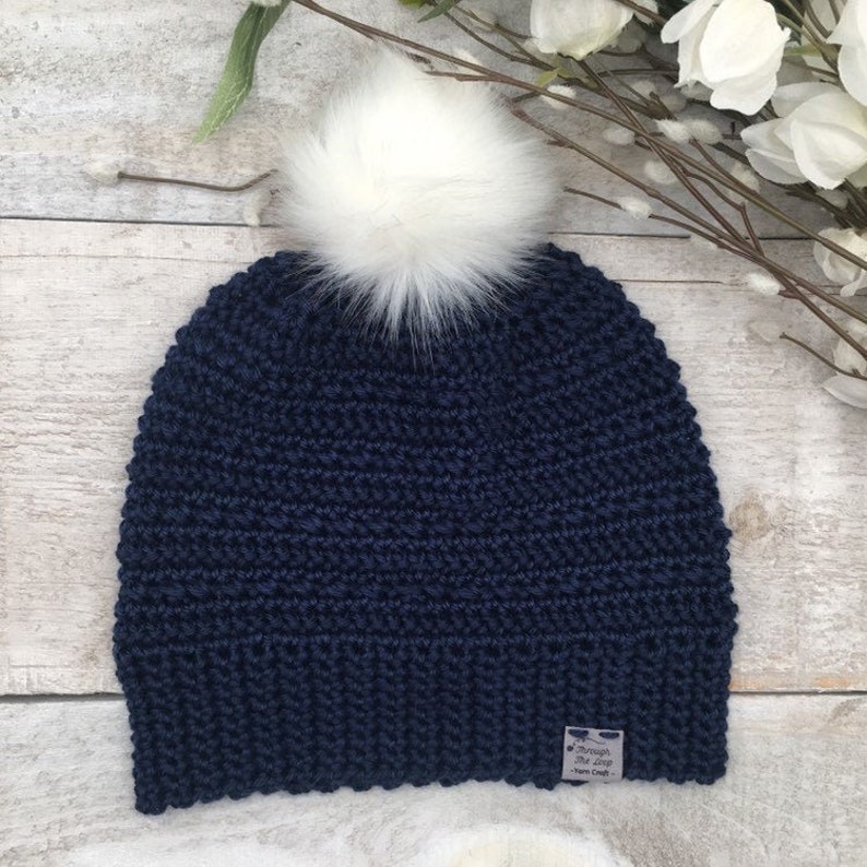 navy blue pom pom hat