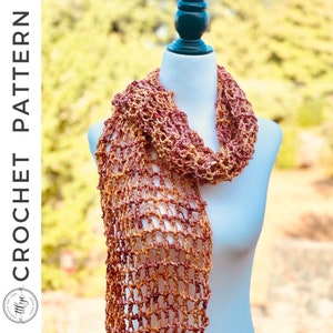 May include: A crocheted scarf in a rust and orange color combination. The scarf is made with a simple stitch pattern and has a loose, flowing drape.
