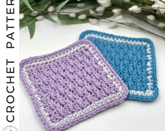 May include: Two crocheted squares, one purple and one blue, with a white border. The squares are made with a textured stitch and are perfect for use as coasters or pot holders.