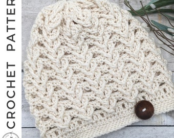 May include: A crocheted beanie hat in a cream color with a textured stitch pattern. The hat has a button on the side.