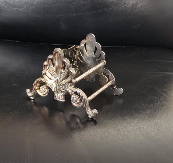 12 PORTE COUTEAUX EN METAL ARGENTE FORME NOEUD TABLE TRES BEAUX