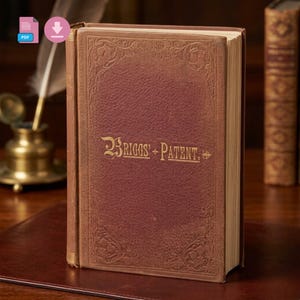 May include: A vintage book with a burgundy cover and gold lettering that reads "BRIGGS + PATENT." The book has ornate embossed designs around the edges. The book is standing upright on a dark surface.