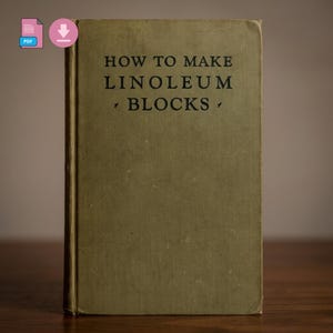 May include: A vintage book titled "HOW TO MAKE LINOLEUM BLOCKS" in black text on a faded olive green cover. The book is standing upright, with a slightly worn appearance, suggesting age and use. The background is a blurred, neutral tone.