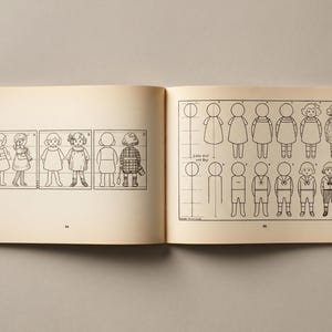 May include: An open book featuring illustrations of children's figures. The left page displays figures in various outfits, while the right page provides step-by-step drawing instructions. The drawings are in black and white.
