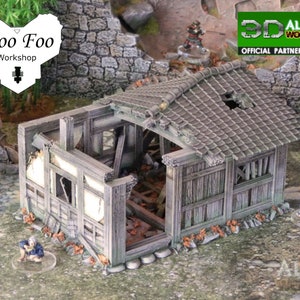 May include: A ruined wooden Japanese-style building with a tiled roof. The building is partially collapsed and has a hole in the roof. The building is made of wood and has a weathered gray finish. The building is surrounded by green grass and rocks. The text "Woo Foo Workshop" is visible in the upper left corner of the image.