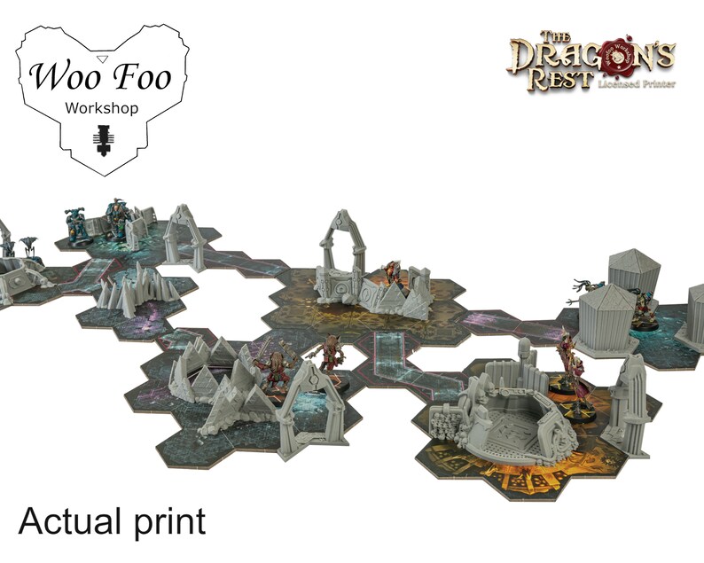 May include: A tabletop gaming terrain set featuring hexagonal tiles and 3D-printed structures. The set includes various gray architectural elements and miniature figures, with the text "Actual print" at the bottom. The logos for "Woo Foo Workshop" and "The Dragon's Rest" are also visible.
