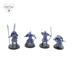 May include: Four unpainted plastic figurines of samurai warriors, each with a different pose and weapon. The figures are standing on black bases.