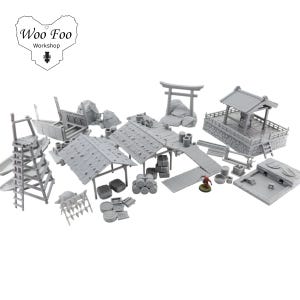 May include: A set of unpainted miniature Japanese buildings and structures, including a torii gate, a well, and buildings with tiled roofs. The set also features barrels, a wooden bridge, and a ladder. The "Woo Foo Workshop" logo is in the upper left.