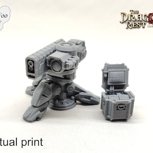 May include: A 3D printed model of a futuristic weapon turret with a box of ammunition. The turret is grey and has a detailed design. The box is also grey and has a hinged lid.