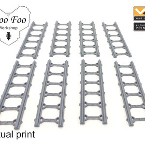 May include: Eight gray plastic train track pieces, each with eight connecting points. The track pieces are arranged in two rows of four. The image is labeled "Woo Foo Workshop" and "Actual print".