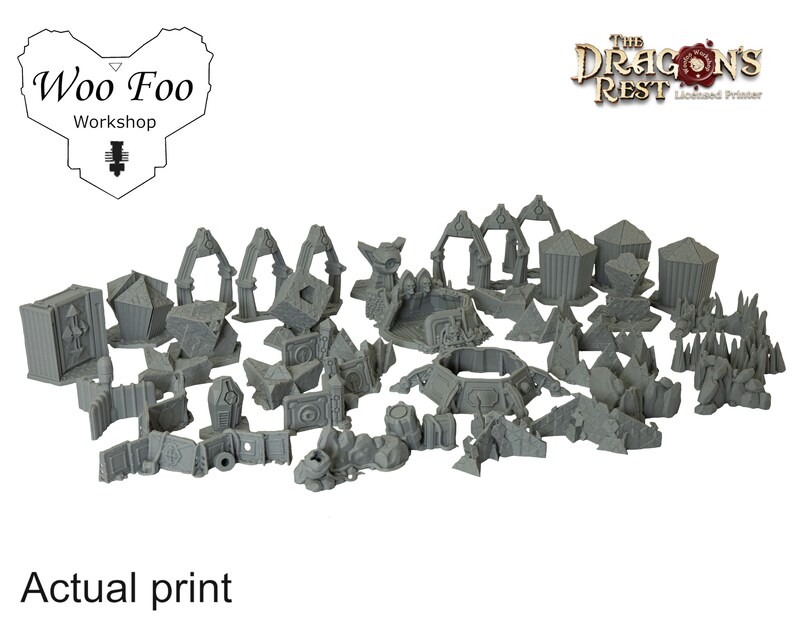 May include: A collection of gray 3D-printed miniature terrain pieces, including arches, walls, and structures. The text "Actual print" is visible at the bottom. The "Woo Foo Workshop" logo is in the upper left corner, and "The Dragon's Rest" logo is in the upper right.