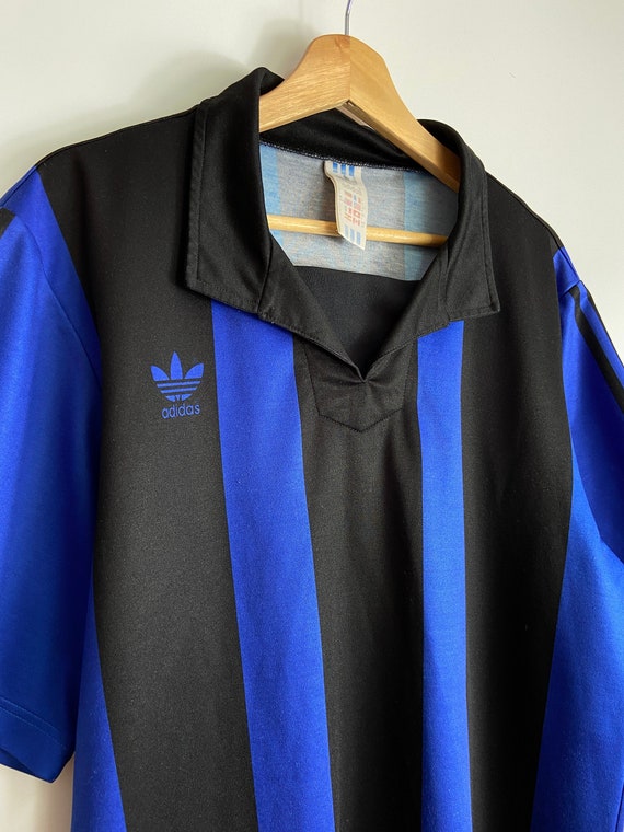 black and blue soccer jersey