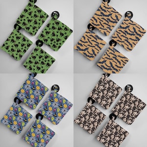 May include: Set of 10 small zippered pouches with various Halloween-themed patterns. The pouches are made of a soft, fabric material and feature a variety of colors, including black, green, orange, and white. The pouches are perfect for storing small items like jewelry, coins, or keys.