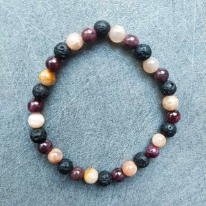 Triple link with his inner fire: Garnet, Lava Stone and Sun Stone