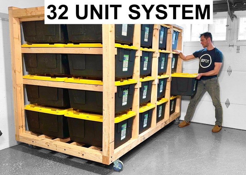 May include: A wooden storage system with 32 black storage bins on four shelves. The system is on wheels and has a "32 UNIT SYSTEM" sign at the top.