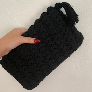 Black crochet clutch purse with tassel zip pull