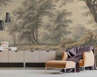 Puede incluir: Un interior de sala de estar con un mural de pared marrón claro que representa un paisaje con árboles y un castillo en la distancia. Un sofá marrón claro con una manta de tiro gris oscuro está en primer plano. Un gabinete marrón claro con tres cajones está en primer plano. Dos luces colgantes negras cuelgan del techo.