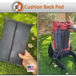 May include: Black cushion back pad and a red, tan, and black backpack on green grass. The cushion is held by a hand. The backpack has black straps and a mesh back. The text "Cushion Back Pad" is at the top.