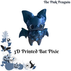 May include: A 3D printed blue bat pixie figurine with large eyes and wings. The figurine is standing on a white background. The text "3D Printed Bat Pixie" is below the figurine.