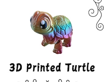 May include: A 3D printed rainbow turtle toy. The turtle has a detailed shell and large, expressive eyes.