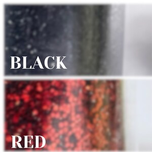 May include: Close-up of two paint swatches, one black and one red. The swatches are textured and show the paint's consistency.