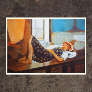 May include: A woman in a blue and yellow polka dot dress lies on a wooden table with her head resting on her arm. The room is painted in shades of blue and orange.