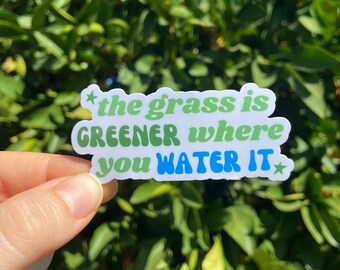 The Grass Is Greener Where You Water It Sticker | Inspirational Quote For Her Gift Cute Stars Black Laptop Decal Encouraging Watering Can