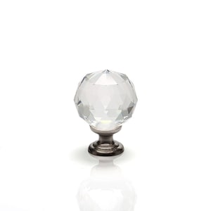 May include: A clear crystal cabinet knob with a faceted design and a silver base.