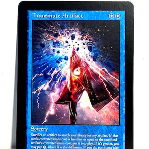 Könnte beinhalten: Eine weiße Keramik-Tasse mit schwarzem Henkel und dem Text "But First, Coffee" in schwarzer, handschriftlicher Schrift. Die Tasse steht auf einer weißen Oberfläche.