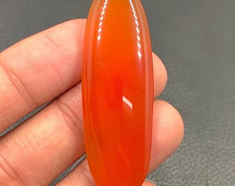 Cabochon en cornaline...Cabochon ovale...53x18x6 mm...49 Cts...A#M5747