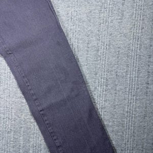May include: A pair of dark gray denim jeans. The jeans are a solid color with visible seams and a classic five-pocket design. The fabric appears to be a medium weight denim.