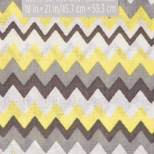 May include: Yellow, gray, and white chevron patterned fabric. The fabric is 100% cotton and measures 18 inches by 21 inches.