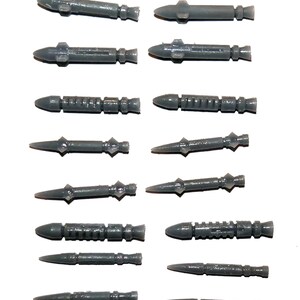 May include: Twelve gray plastic model missiles, each with a different design and shape. The missiles are arranged in two rows of six, with the tips pointing towards the right.