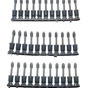 May include: Three rows of gray plastic model parts, each with a cylindrical body and a flared base. The parts are arranged in a straight line on a gray plastic strip. The background is plain white.