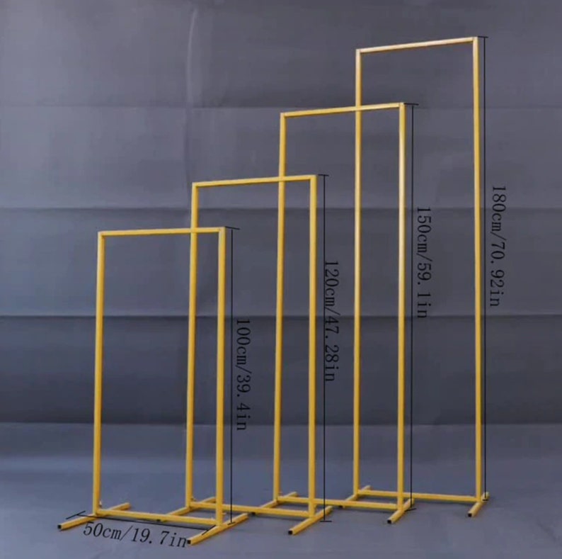 May include: Four gold metal arch stands of varying heights. The tallest is 180cm, the next is 150cm, then 120cm, and the shortest is 100cm. The base is 50cm wide. These stands are suitable for events and decorations.