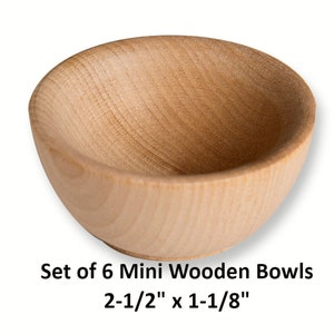 May include: Set of six mini wooden bowls, each measuring 2-1/2 inches by 1-1/8 inches. The bowls are made of natural wood and have a smooth, rounded shape.
