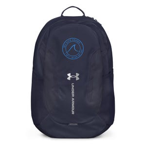 May include: A navy blue backpack featuring a top handle, two side mesh pockets, and a silver Under Armour logo with text. A circular blue graphic on the upper front displays a wave icon and the text Sea Suite Cruises Get Y Gether Get Away.