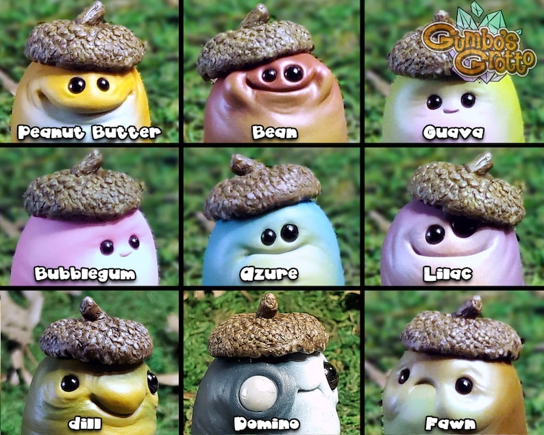 May include: Nine small, hand-painted, acorn-shaped figurines with different colours and facial expressions. Each figurine has a unique name, including Peanut Butter, Bean, Guava, Bubblegum, Azure, Lilac, Dill, Domino, and Fawn.