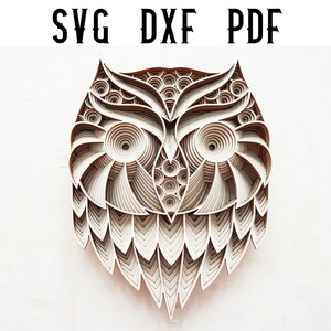 May include: A layered wooden owl design with intricate details, ideal for laser cutting and creating a unique home decor piece.
