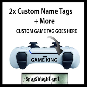 May include: A white games controller with black buttons and the text "GAME KING". The image includes the text "2x Custom Name Tags + More" and "CUSTOM GAME TAG GOES HERE". The logo "splashlight-art" is also visible.