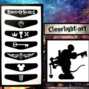 May include: A black and white decal sheet featuring Kingdom Hearts themed icons including the logo, heart symbols, keyblades, and a Mickey Mouse silhouette. A separate square decal shows a black silhouette of Mickey Mouse holding a keyblade.