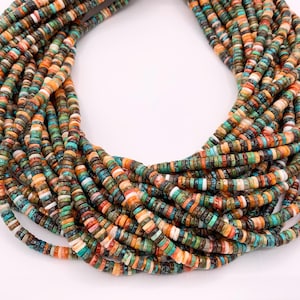 May include: A necklace composed of numerous small, flat, round beads in a variety of colors, including orange, turquoise, brown, and white. The beads are strung together to form a layered, circular design, suitable for jewelry.