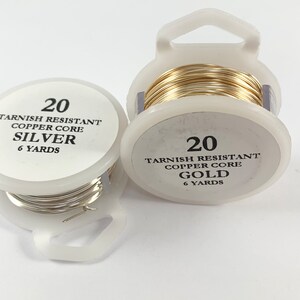 May include: Two spools of 20 gauge tarnish resistant wire, one silver and one gold, each with a copper core. Both spools contain 6 yards of wire.