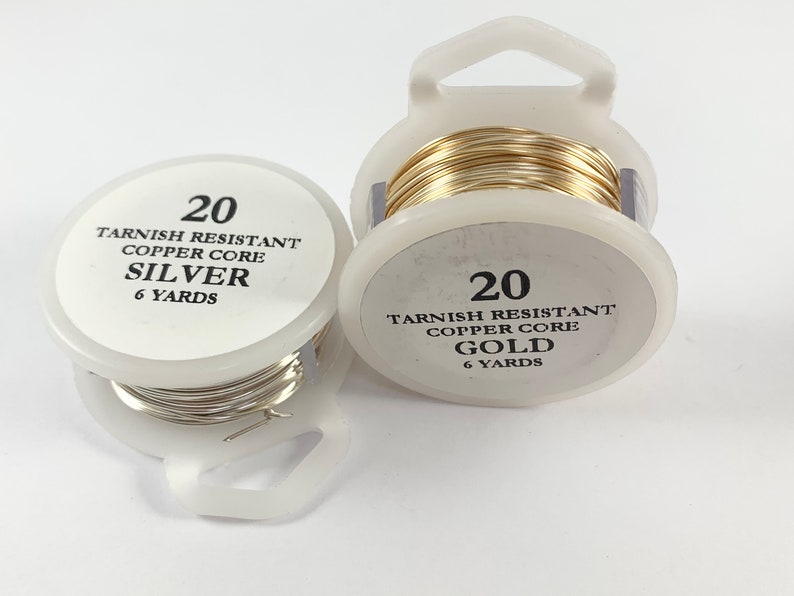 May include: Two spools of 20 gauge tarnish resistant wire, one silver and one gold, each with a copper core. Both spools contain 6 yards of wire.
