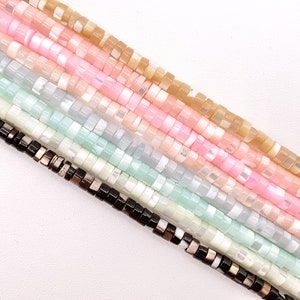 May include: A strand of iridescent shell beads in various pastel colors, including beige, pink, and green. The beads are small and round, and they are strung together on a clear thread.