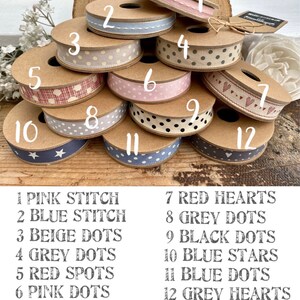 May include: Twelve spools of ribbon with different patterns and colours. The ribbons are numbered 1 through 12 and each ribbon has a corresponding description below the image. The ribbons include pink stitch, blue stitch, beige dots, grey dots, red spots, pink dots, red hearts, grey dots, black dots, blue stars, blue dots, and grey hearts.