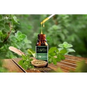 May include: A brown glass bottle with a dropper filled with oregano essential oil. The bottle has a white label with the text "ZaluBe" and "Therapeutic Grade Oregano pure essential oil".